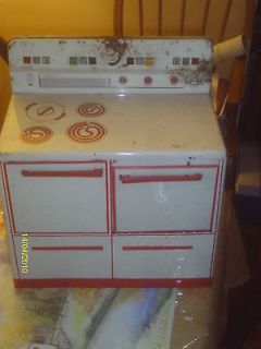 Newly listed VTG metal toy stove with metal pots and pans, utensils 