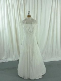 Ivory Strapless Wedding Dress with Ivory Embellishments by David’s 