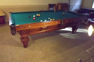 Antique Brunswick pool table in Tables