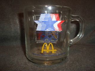   1984 OLYMPICS OG LOGOS (BASEBALL,SOCCER,,ETC) GLASS CUP #1 WITH HANDLE