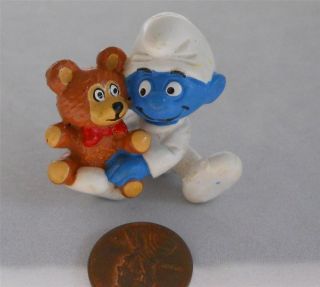 Vintage 1982 Peyo Baby Smurf with teddy bear