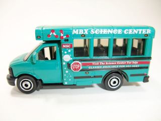 2011 Matchbox City Life GMC School Bus TEAL/MBX SCIENCE CENTER/MINT
