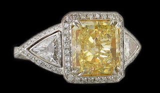 Yellow canary fancy diamond ring 4.25 cts. white gold