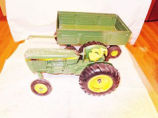 JOHN DEERE TRACTOR 1500H ON BOTTOM OF TOY WITH ERTL GREEN WAGON HAS 