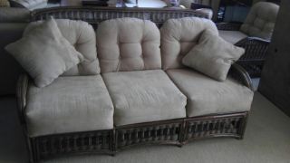 WICKER CUSHION COUCH WITH MATCHING END TABLE FROM MODEL HOME