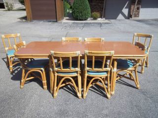   Vintage 1950s Rattan Dining Table w/ 3 Self Storing Leaves & 4 Chairs