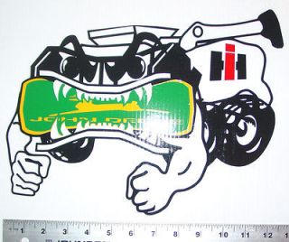 International Harvester sticker eating John Deere logo