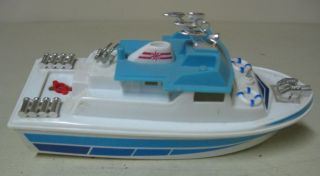 COLLECTIBLE BLUE AND WHITE PLASTIC BATTERY OPERATED BOAT SHIP CRUISER