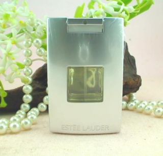 encased in a Platinum Colored Case embosed with the Estee Lauders 
