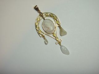   BUT THE CENTER DANGLE DROP IS GLASS. ITS REALLY UNIQUE AND BEAUTIFUL