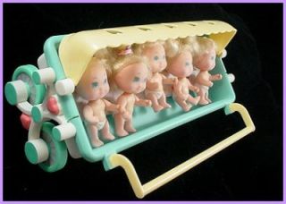 This listing is for the lot of Tyco Quints baby dolls, carriage and 