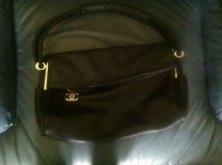 CHANEL Black leather handbag. Silver Hardware. CC Monogram. Fold over 