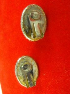 ARE A PAIR OF VINTAGE CLIP ON EARRINGS MADE BY DESIGNER ARNOLD SCAASI 