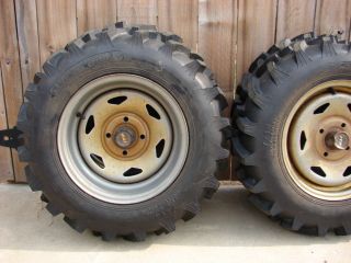 Ag Tires (4) and steel wheels four hole lug fits most Hondas and other 