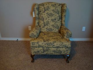   kind newly reupholstered chair has a branch, flower and bee motif