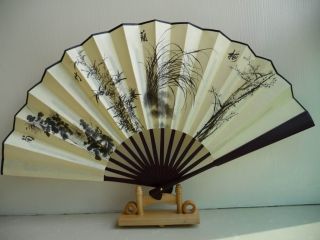 this is a folding fan display stand it s made of wood please note this 