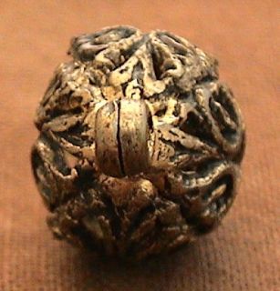 Pretty antique brass cricket cage button. It measures 1/2 inch and has 
