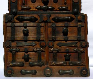 An exceptional and unusual, folky decorated seven drawer cupboard