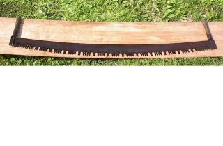 for a terrific antique crosscut saw Has its original wooden handles