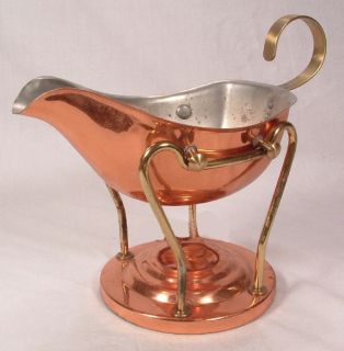  dinner with this copper gravy boat and cradle. Candles not included