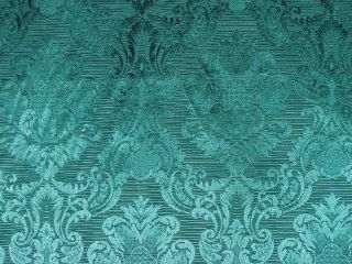  is a traditional damask upholstery fabric in green the green color is