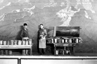 Artist Delmer J. Yoakum (left) painting the Grand Canyon diorama in