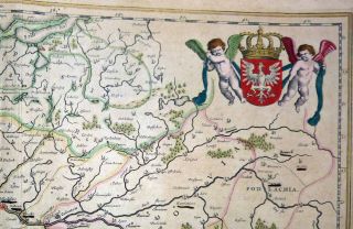  globe and mileage scale beneath an escutcheon ofthe Arms of Silesia