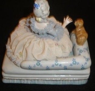 dresden figurine of a lady with dog