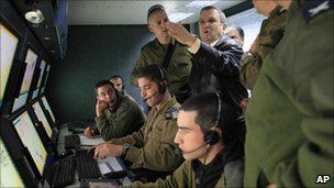Israeli Defence Minister Ehud Barak visits the control room of an Iron