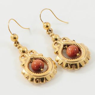 Drop earrings with a goldstone bead made in 9 carat gold and dating to