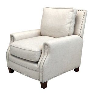 Nailhead trims impart a high design detail to a basic comfy armchair.