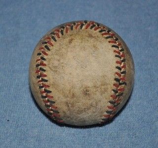 Old ball with multi color stitches. Ball shows its age, but displays