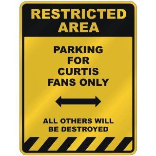 RESTRICTED AREA  PARKING FOR CURTIS FANS ONLY  PARKING