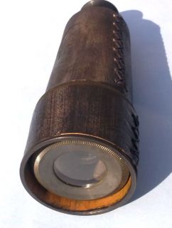  is for a reproduction KELVIN & HUGHES Maritime Brass telescope