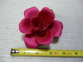 You are bidding on an italian collectable rose, not sure what it is