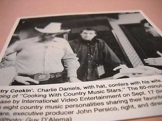 CHARLIE DANIELS confers w/ wife HAZEL at cooking video shoot 1987