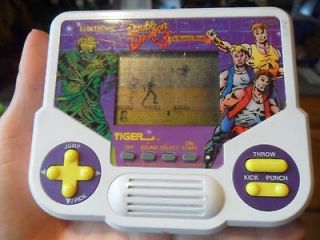 1990 ELECTRONIC DOUBLE DRAGON THE ROSETTA STONE GAME IN GOOD USED