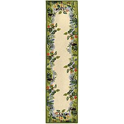Hand hooked Safari Beige/ Green Wool Runner (26 X 10) (BeigePattern BorderMeasures 0.375 inch thickTip We recommend the use of a non skid pad to keep the rug in place on smooth surfaces.All rug sizes are approximate. Due to the difference of monitor col