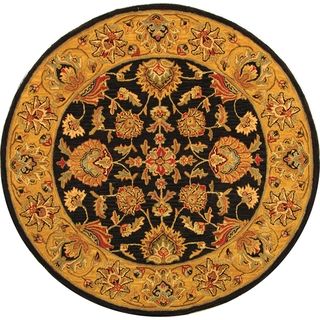 Handmade Heritage Kerman Charcoal/ Gold Wool Rug (36 Round) (GrayPattern OrientalMeasures 0.625 inch thickTip We recommend the use of a non skid pad to keep the rug in place on smooth surfaces.All rug sizes are approximate. Due to the dyeing process and
